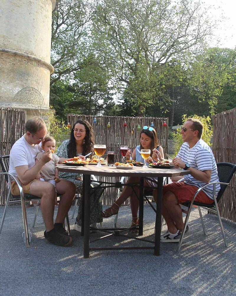 Travelers enjoying a meal at the campsite restaurant near Calais Port, perfect for a stress-free dinner before an early morning ferry departure.